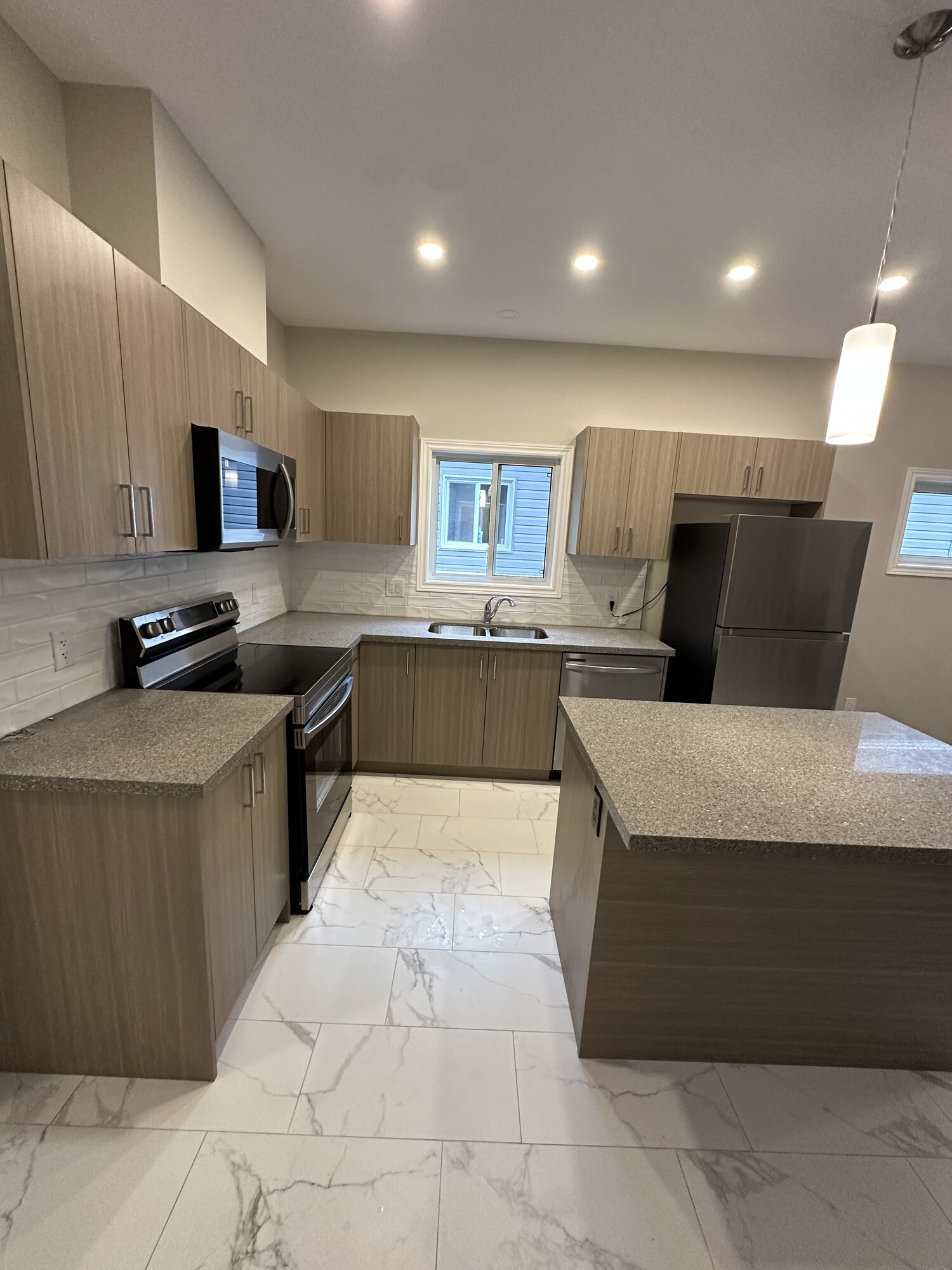 Open-Concept Kitchen — Quartz Island & Full Appliances — Renovations project by Redstone Construction in Brampton, ON