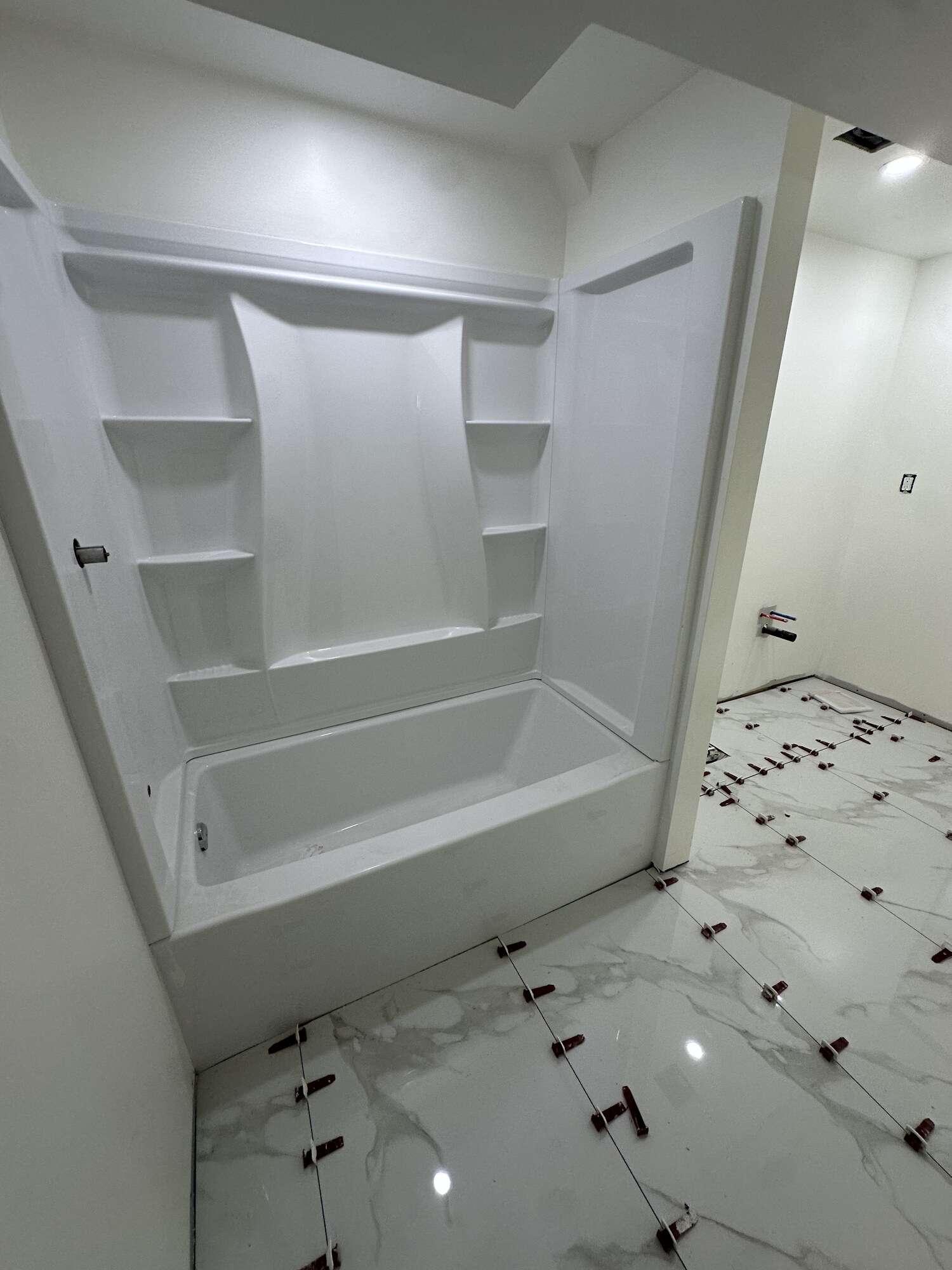 Tub Surround Install & Porcelain Floor Tile — Renovations project by Redstone Construction in Brampton, ON