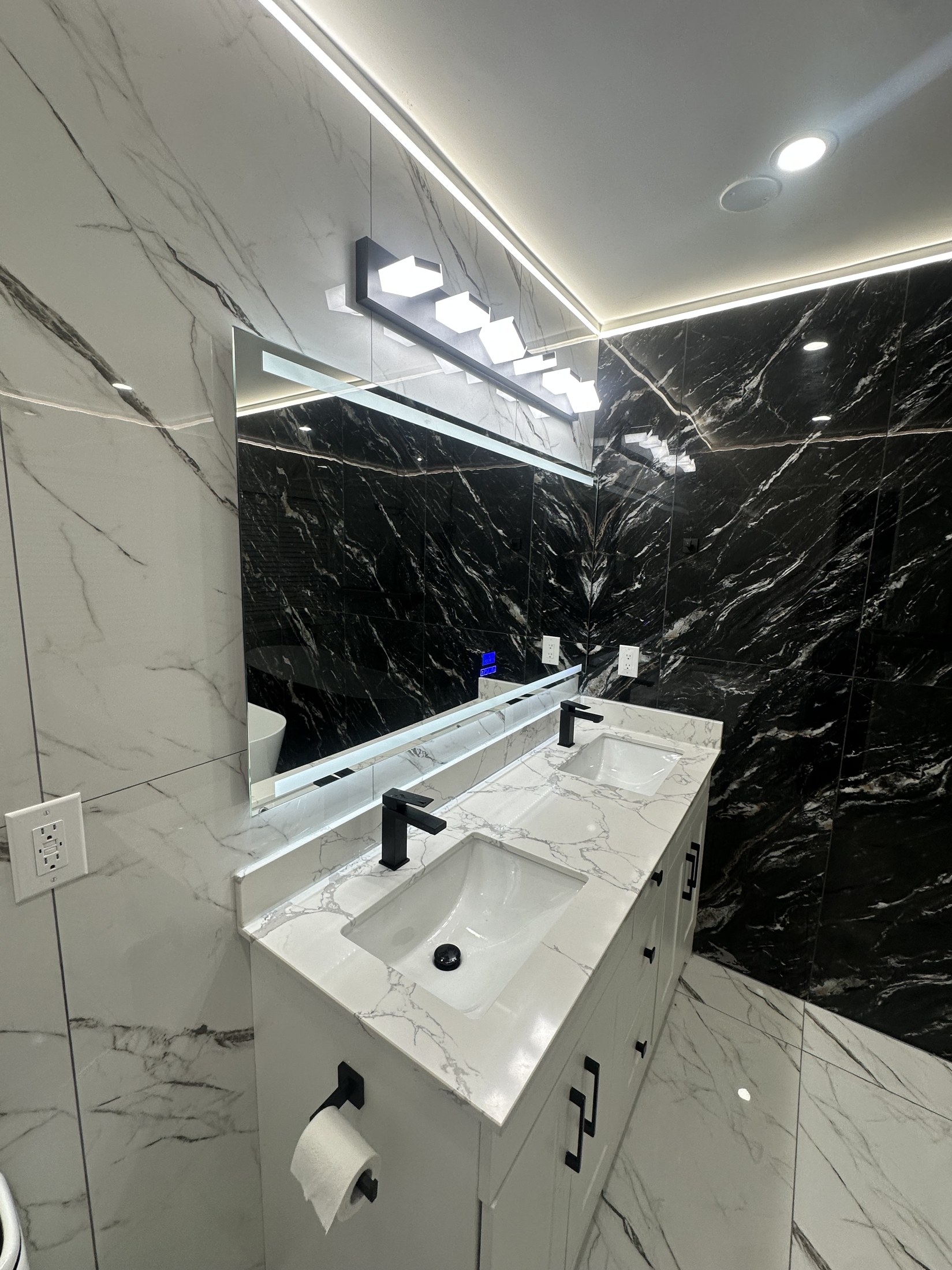 Black Marble Feature Wall & Floating Vanity — Renovations project by Redstone Construction in Brampton, ON