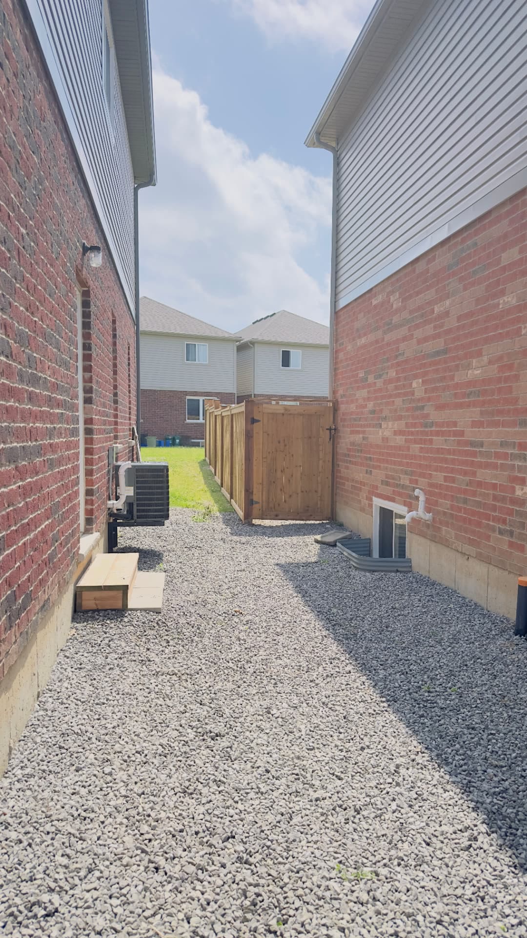 Side-Yard Gate & Gravel Drainage — Exterior project by Redstone Construction in Brampton, ON
